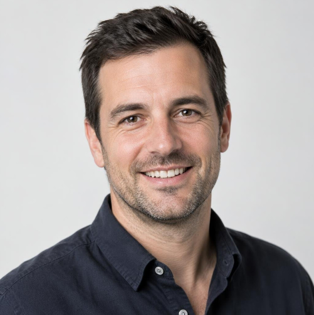 Portrait of a smiling man with short dark hair