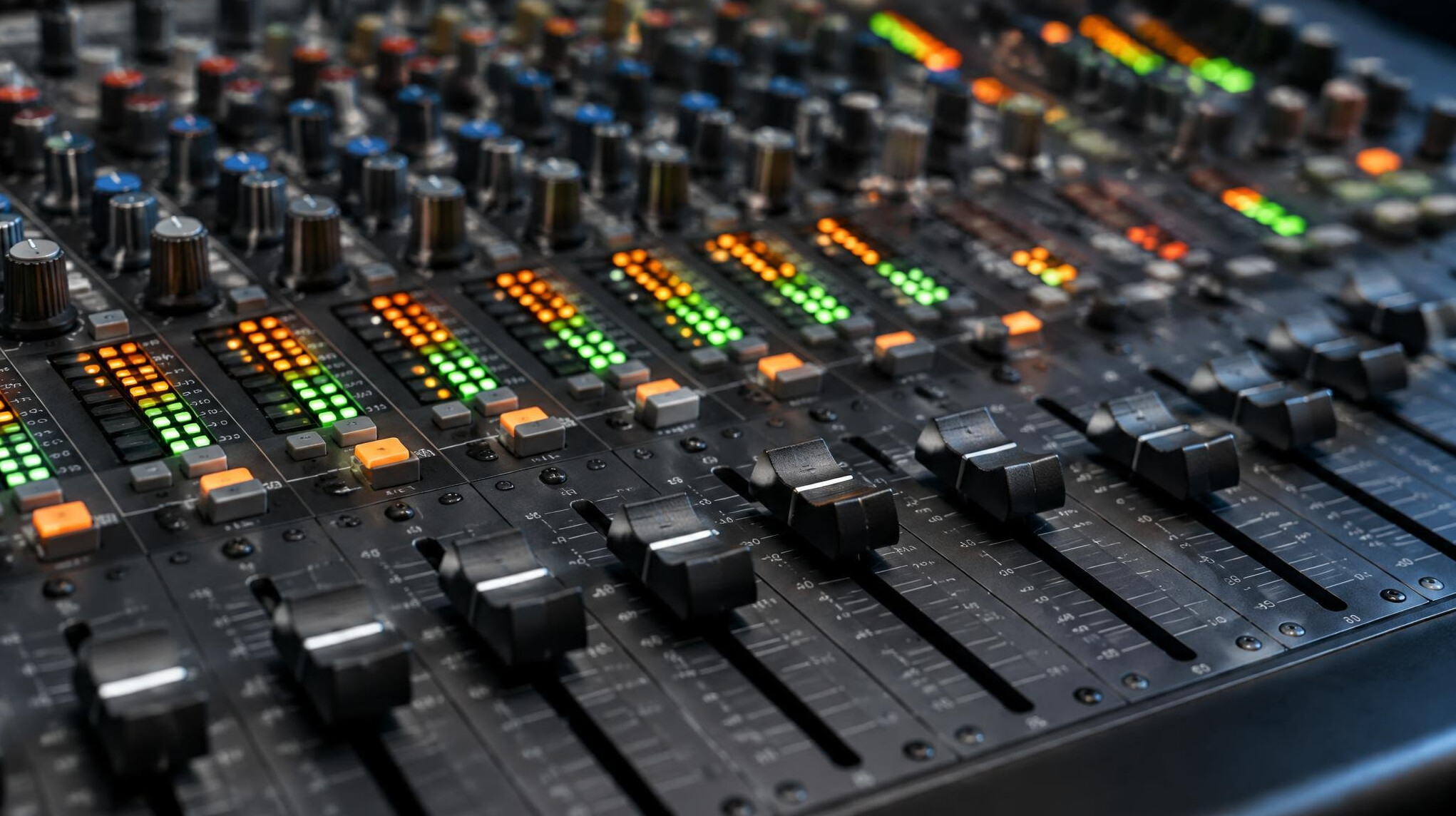 Audio mixing console with faders